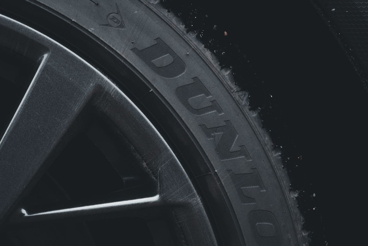Sidewall of a tyre showing the brand markings and DOT date code
