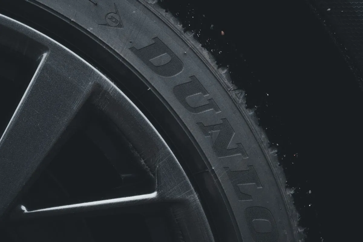 Sidewall of a tyre showing the brand markings and DOT date code
