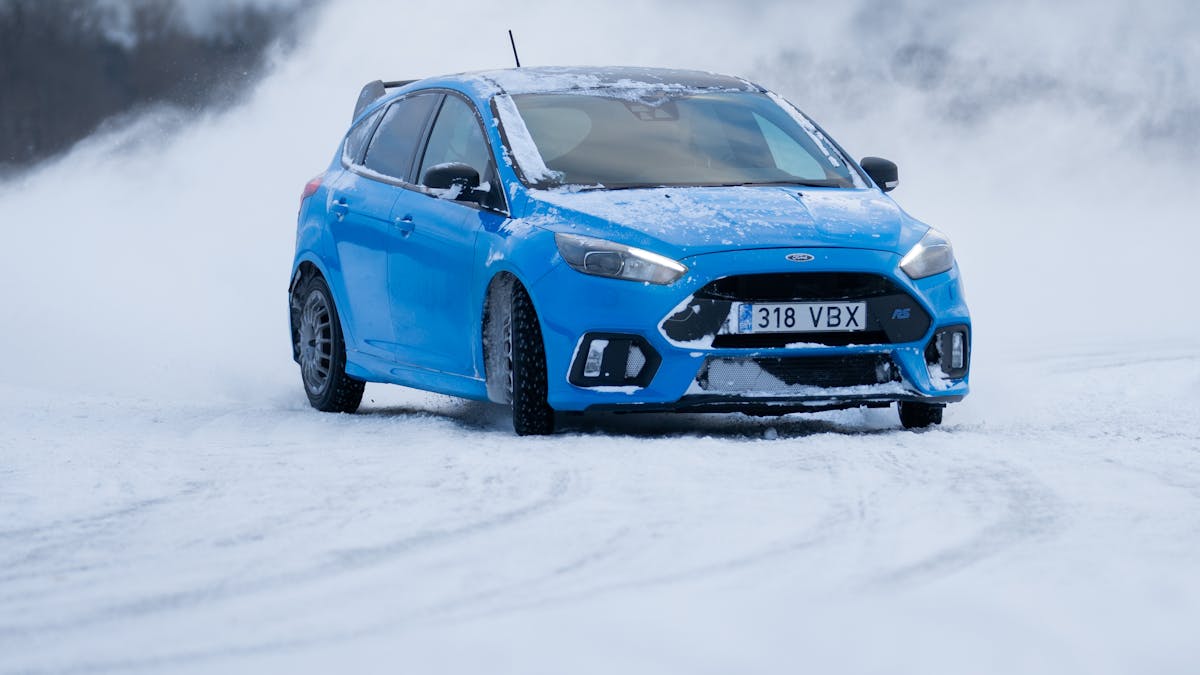 A car driving carefully on a snowy road