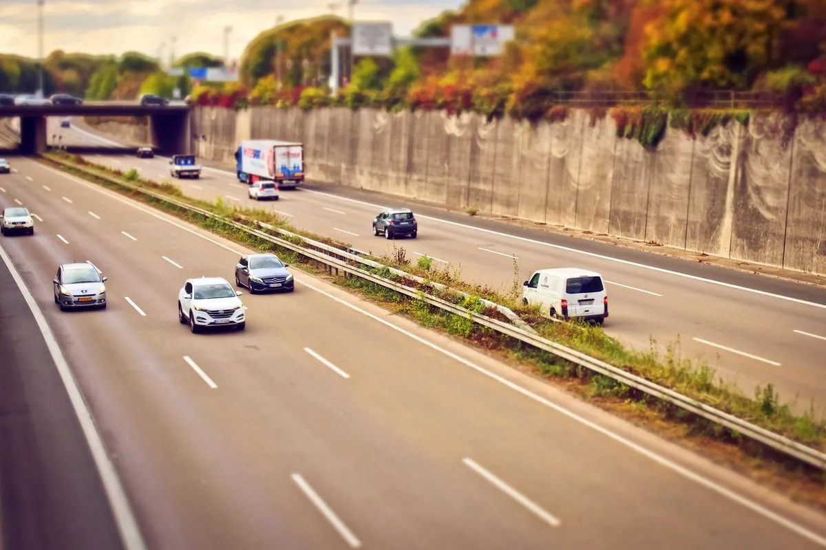 Cars on a busy motorway during a hot summer day