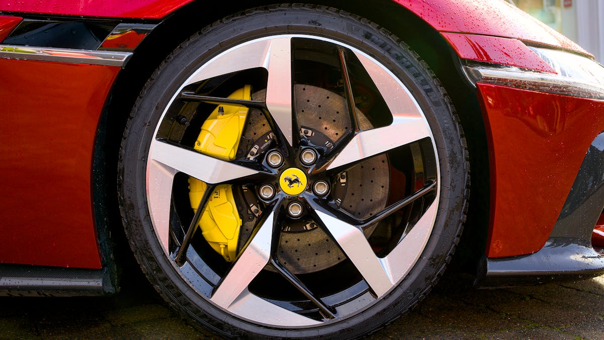 A TPMS sensor being replaced inside a tyre