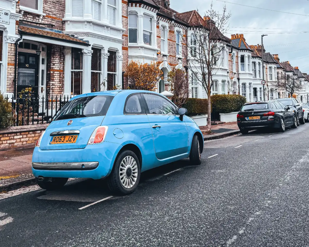 Small car parked on a terraced street