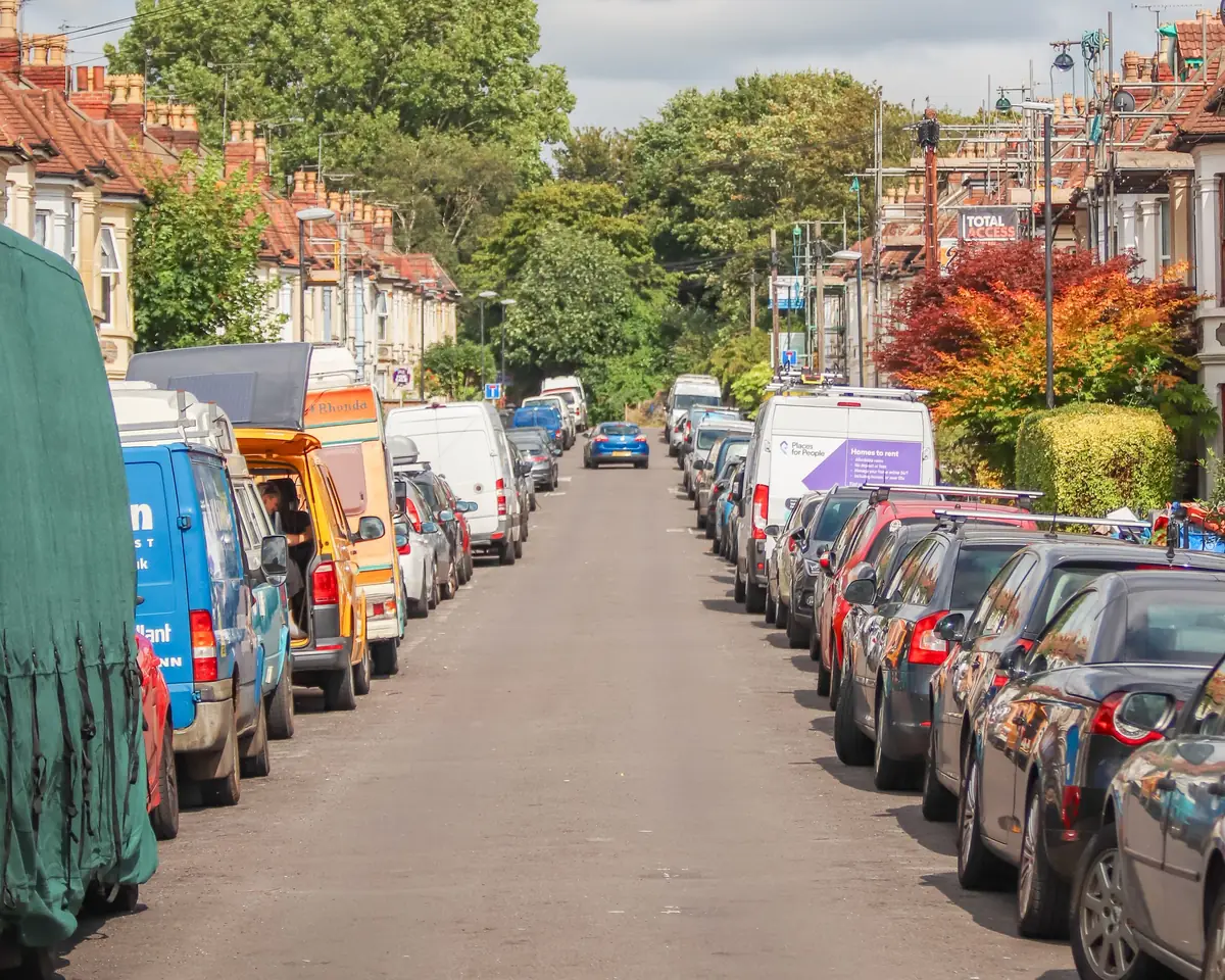 Cars parked along a terraced street