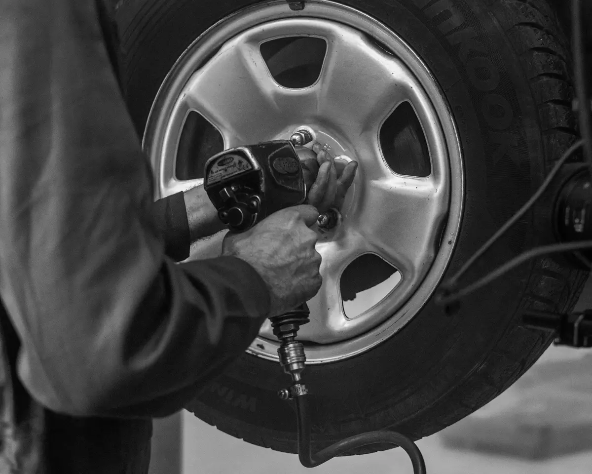 Air wrench on a car's wheel nuts